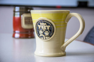 Yellow Swirlware logo coffee mug