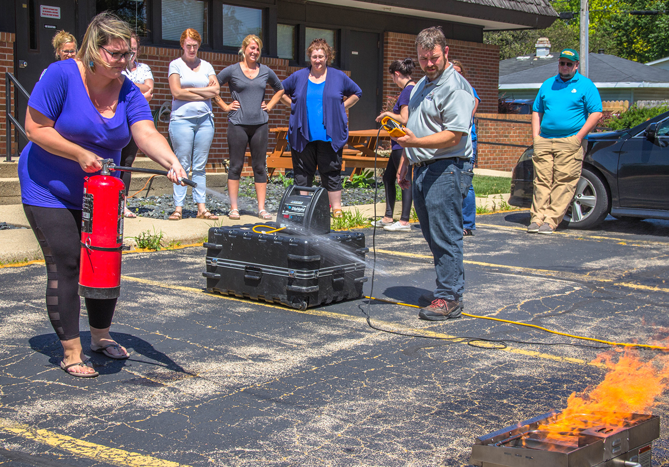 Woman extinguishing fire